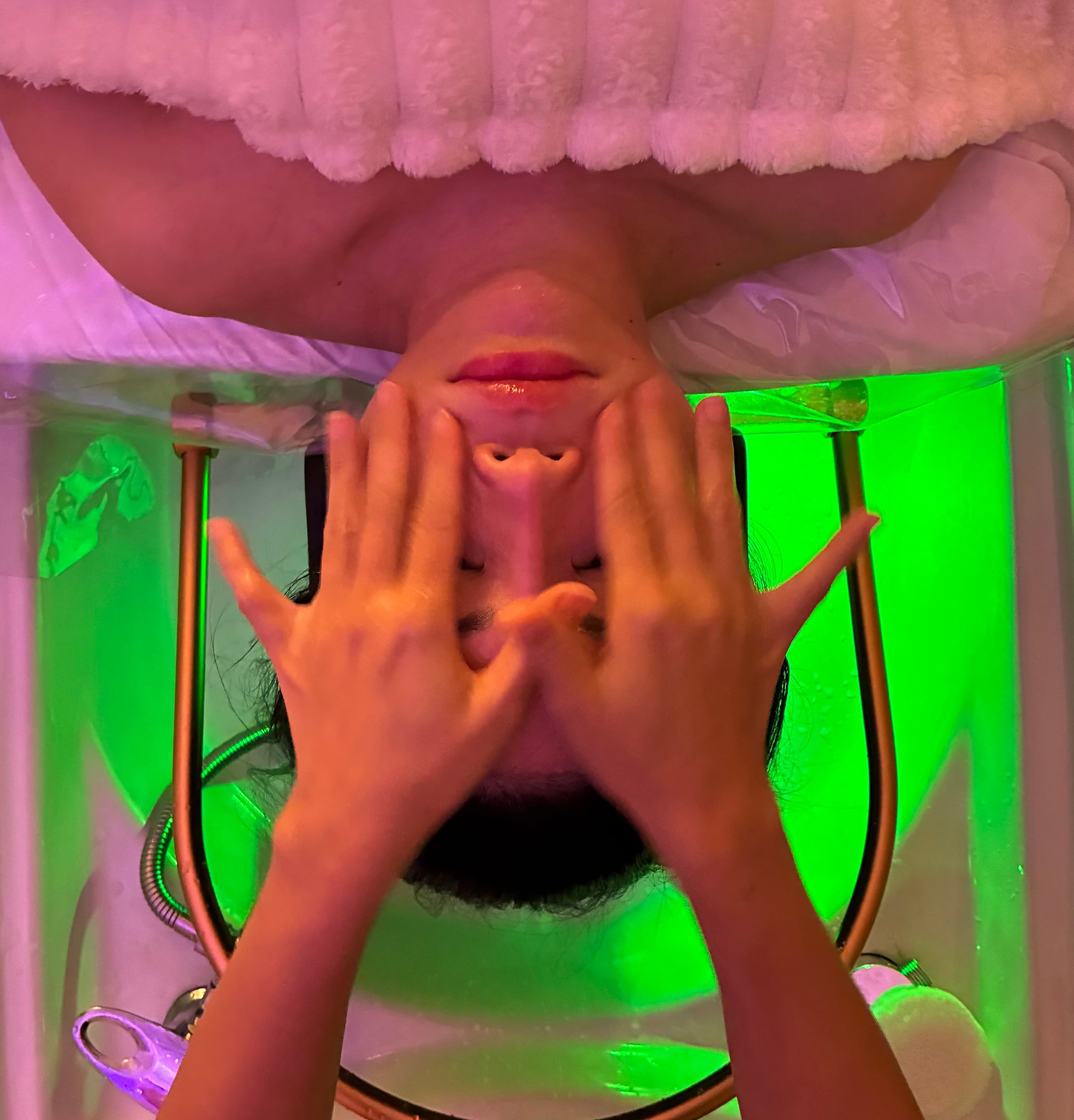 Luxury face massage with vibrant green LED basin